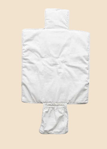 White quilted coverlet on a white background