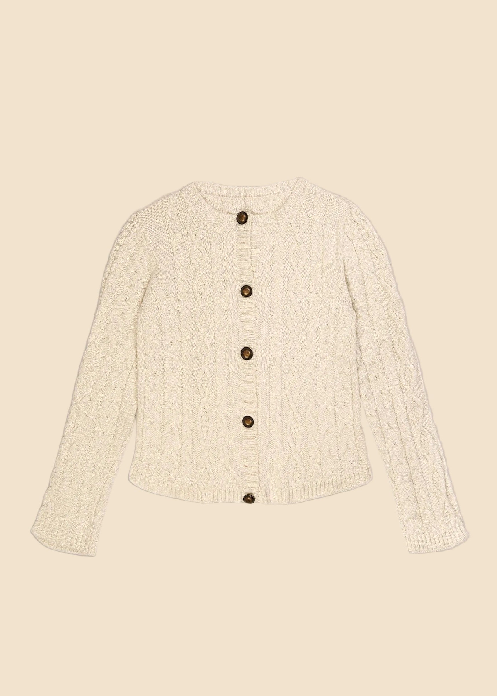 Cream-colored cable knit cardigan with buttons on a beige background