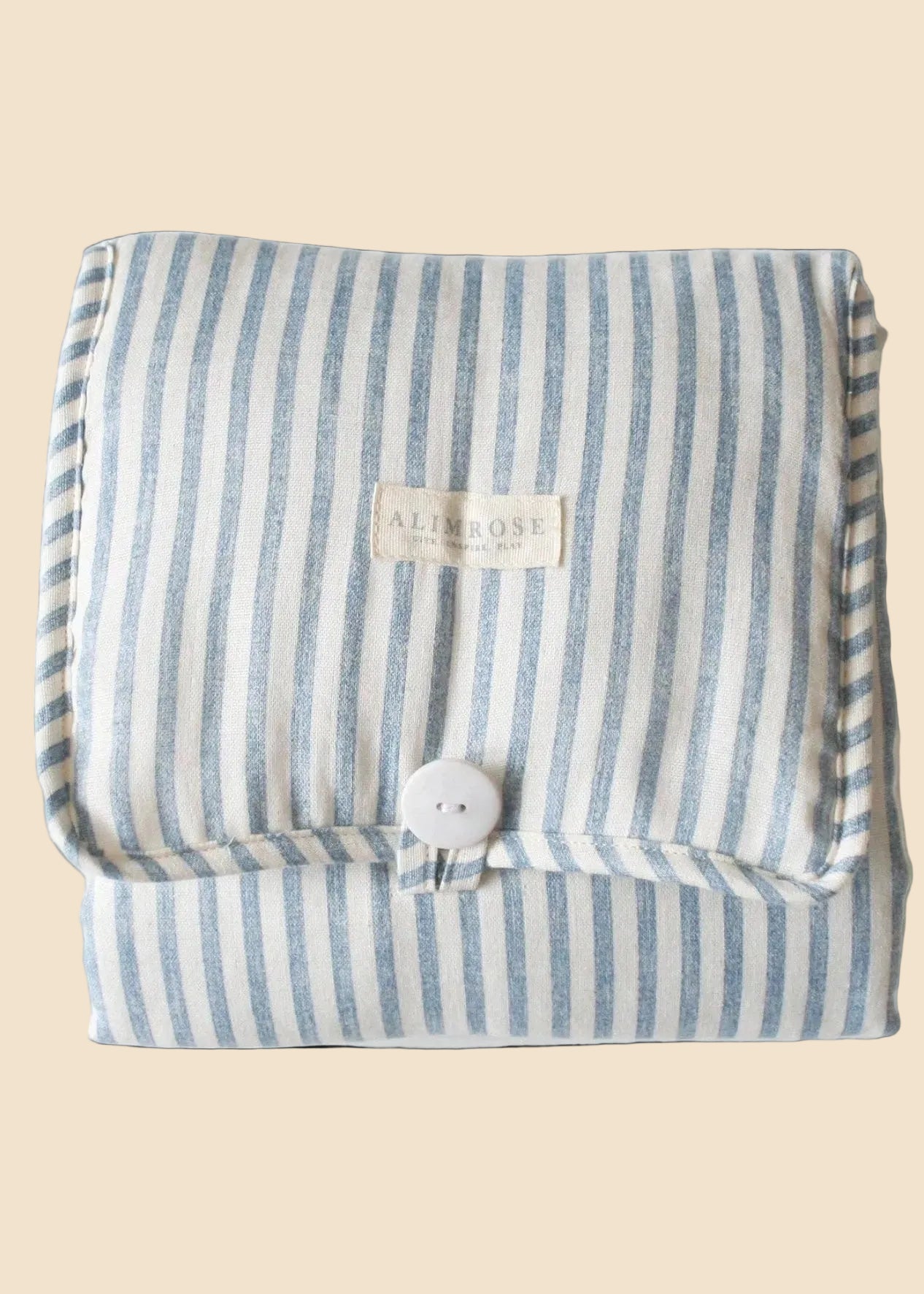 Striped fabric with a button and label on a black background