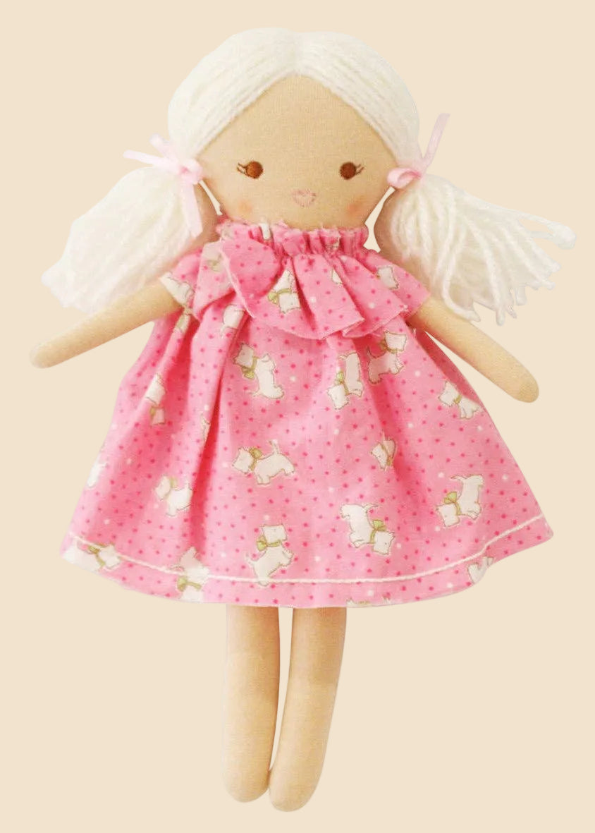 Doll with a pink dress featuring sheep patterns on a white background