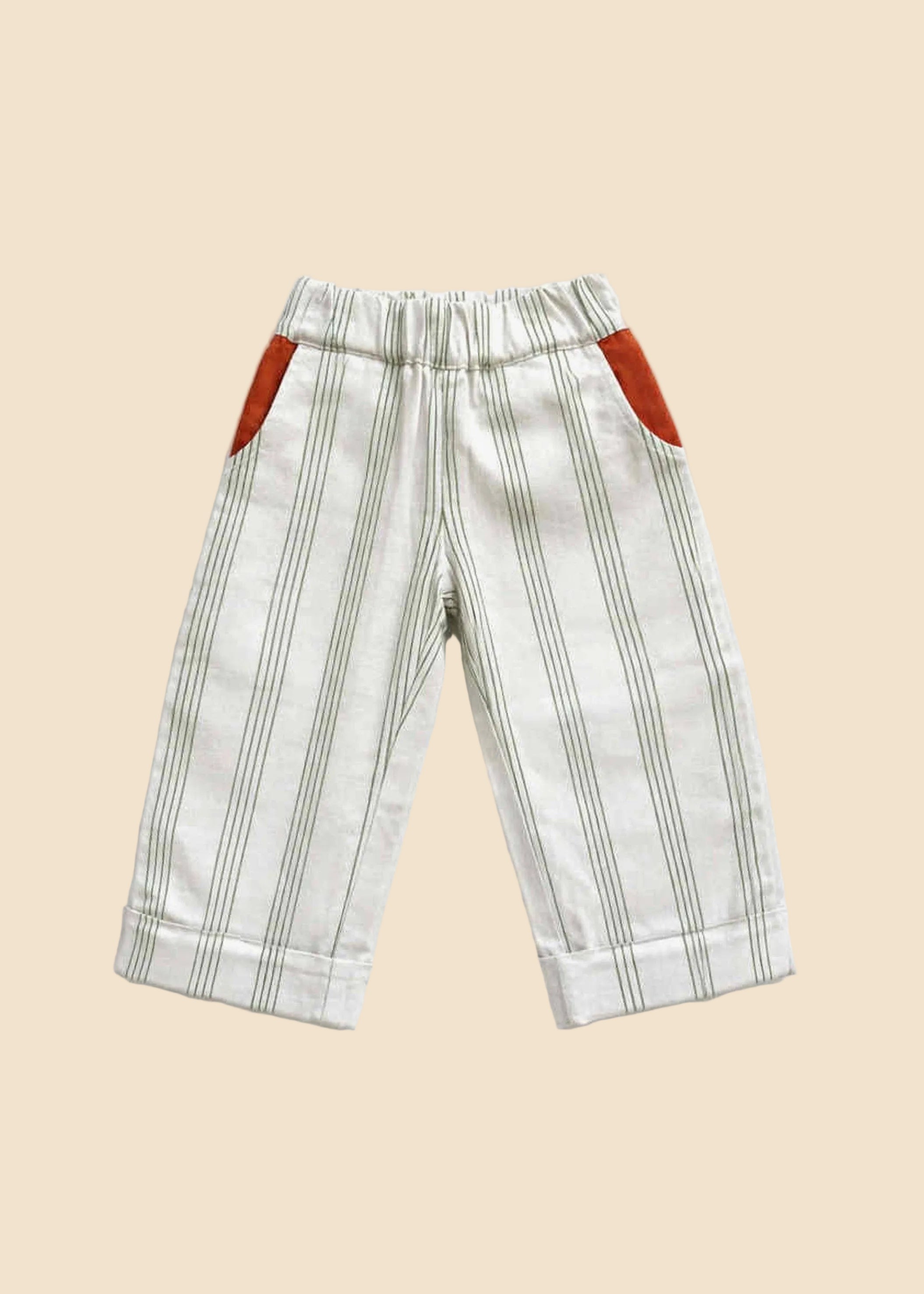 Striped pants with red accents on a light gray background