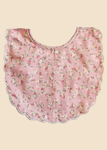 Floral-patterned bib on a white background