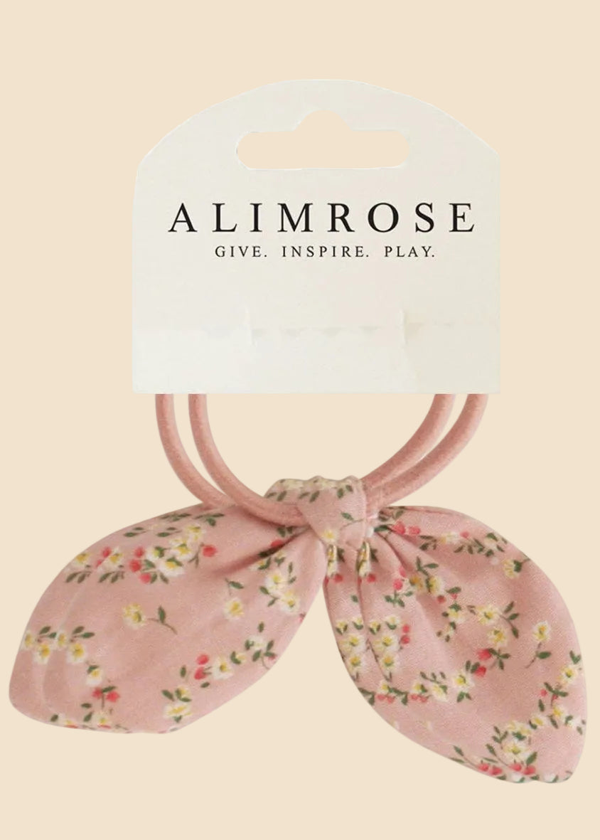Floral pink hair ties with 'Alimrose' packaging on a white background
