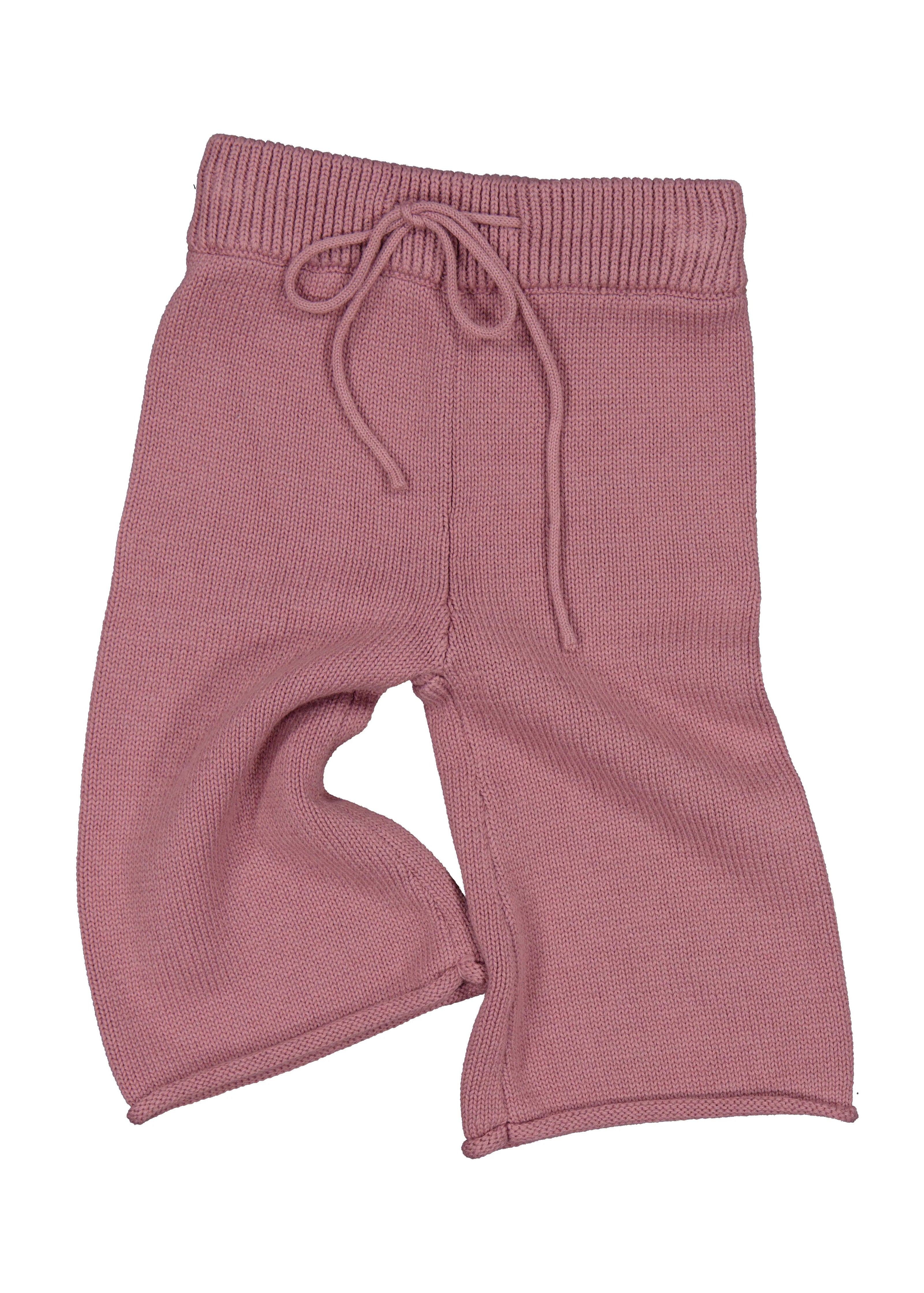 Pink ribbed knit pants with drawstring on a white background