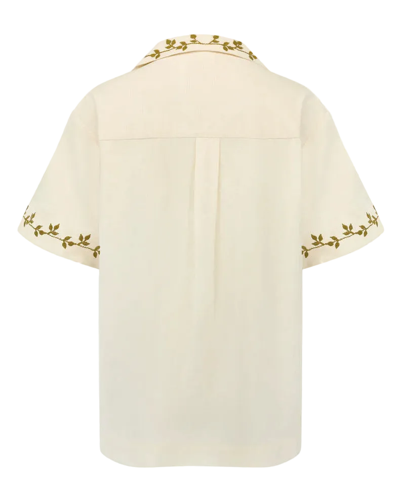 Beige cape with gold embroidery on a white background