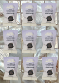 Grid of packages of 'Double Chocolate' dark chocolate covered dates on a reflective surface.