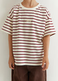Person wearing a red and white striped shirt with text on a plain background