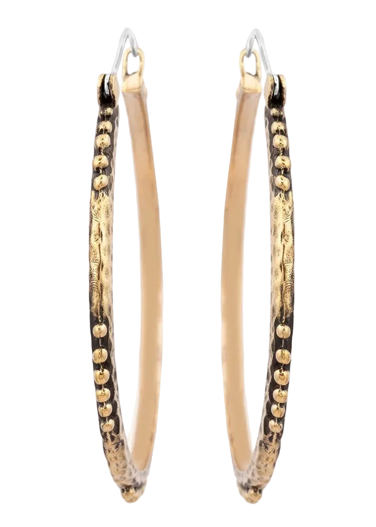Gold hoop earrings with textured design on a white background