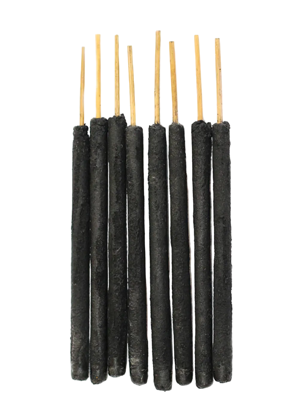 Set of black incense sticks with wooden tops on a white background