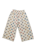 Beige pants with colorful star pattern on a white background