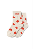A pair of cream-colored crew socks with red star patterns and 'SUNDAY SIBLINGS' printed in red on the cuff, displayed on a clean white background.