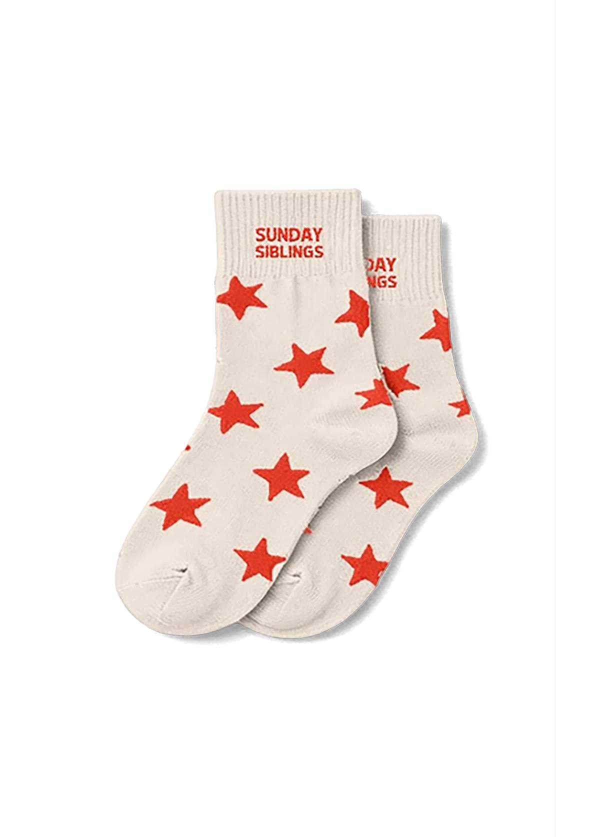 A pair of cream-colored crew socks with red star patterns and 'SUNDAY SIBLINGS' printed in red on the cuff, displayed on a clean white background.
