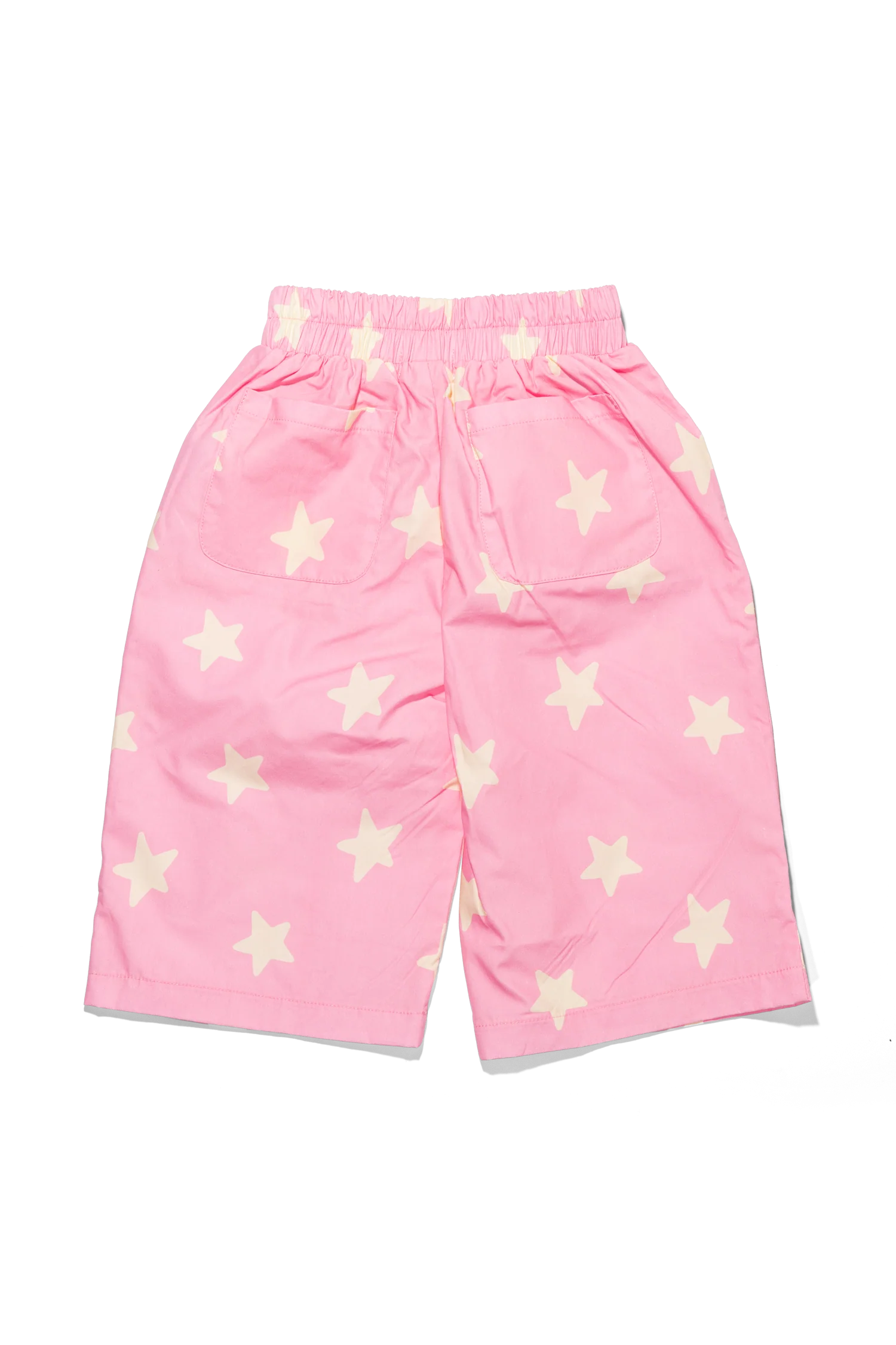 Pink pants with star patterns on a white background