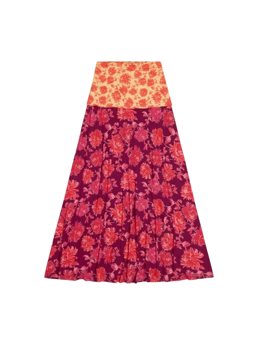 Floral patterned skirt with orange top and purple bottom on a white background