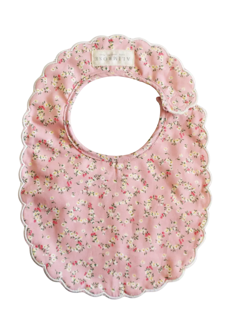 Floral-patterned baby bib on a white background