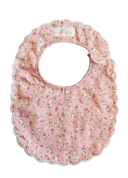 Floral-patterned baby bib on a white background