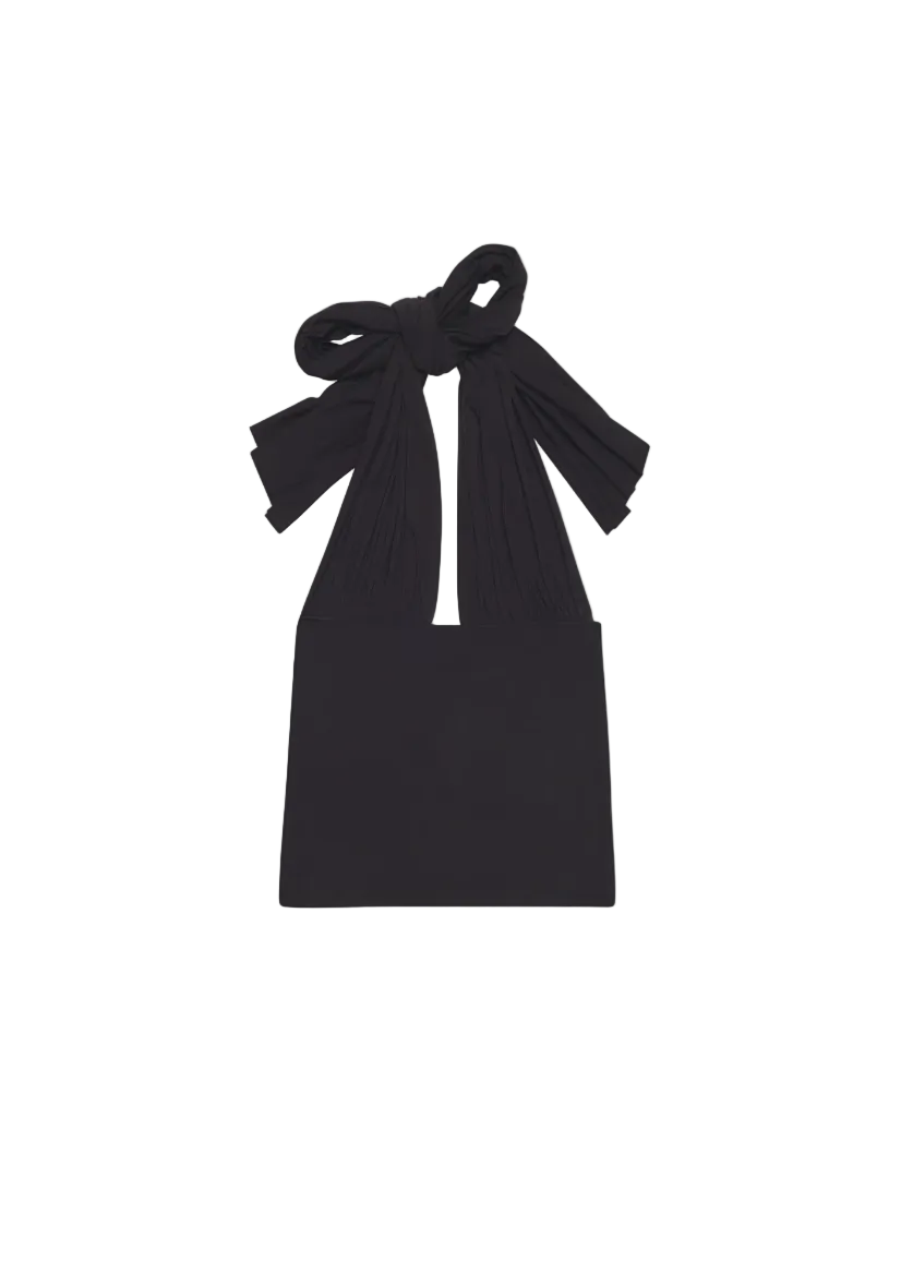 Black dress with a bow detail on a white background