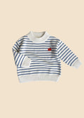Striped sweater with a red apple design on a white background