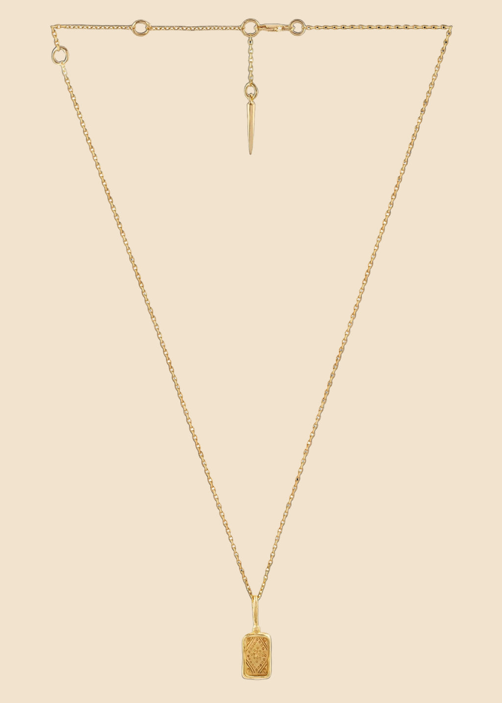 Gold necklace with a pendant on a white background