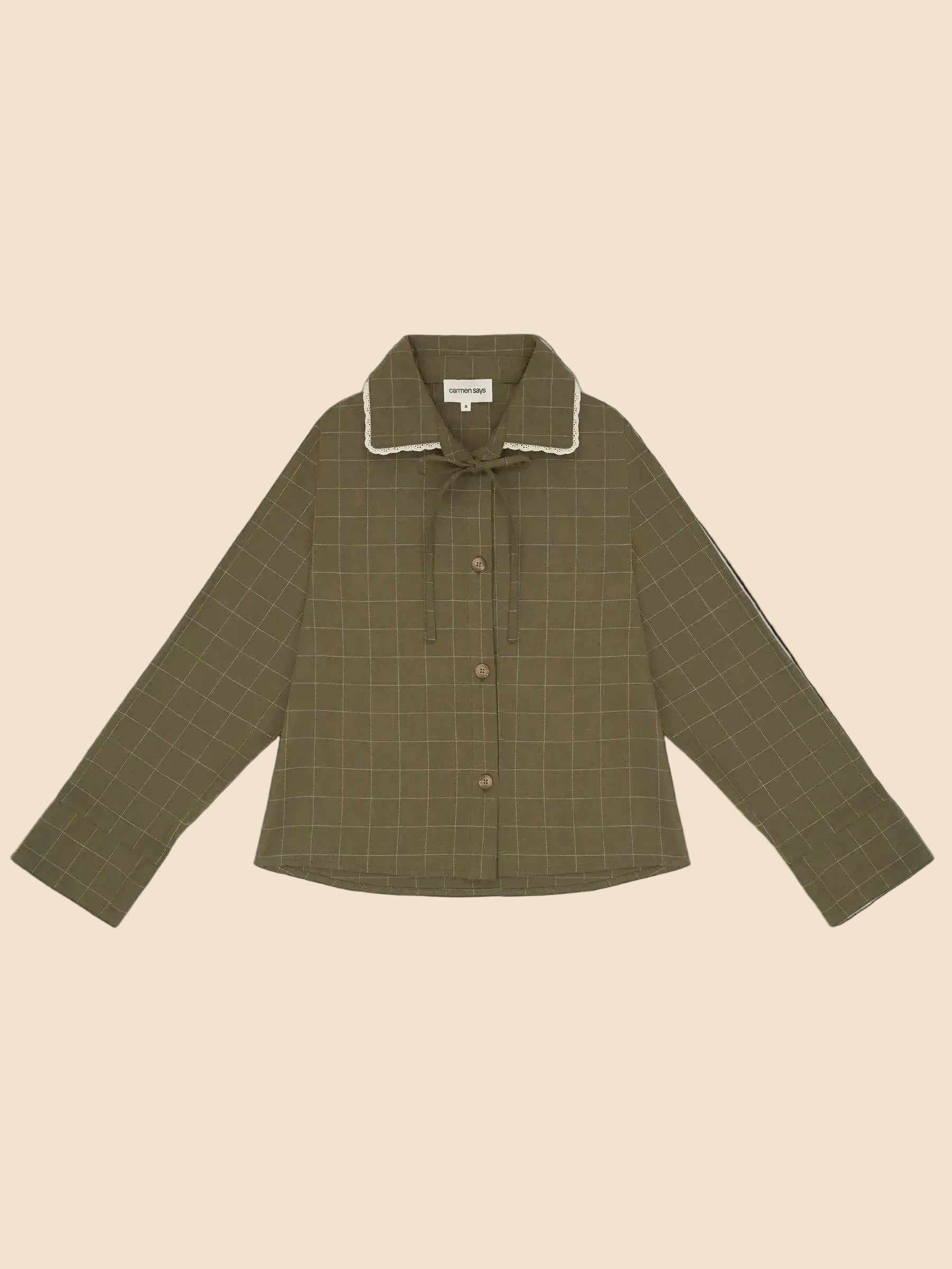 Green checkered shirt with white collar on a light gray background